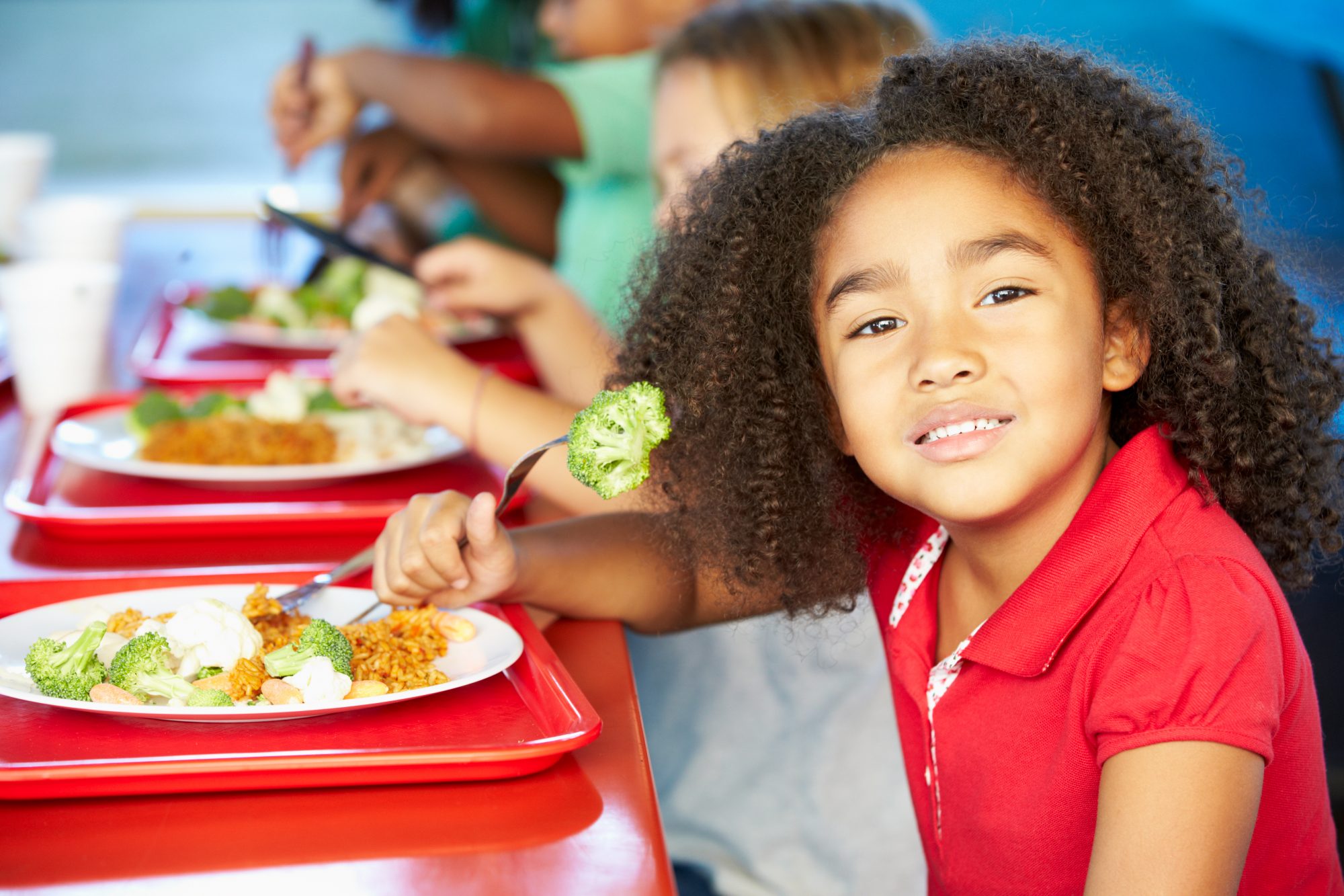 Girl eating school lunch 