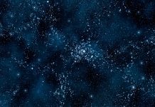 Deep blue space background filled with nebulae and myriads of stars