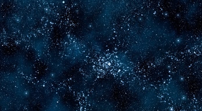 Deep blue space background filled with nebulae and myriads of stars