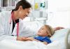 Doctor/nurse looking after child patient