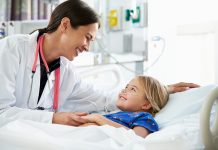 Doctor/nurse looking after child patient