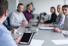 board room meeting with technology