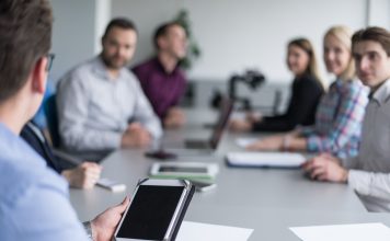 board room meeting with technology