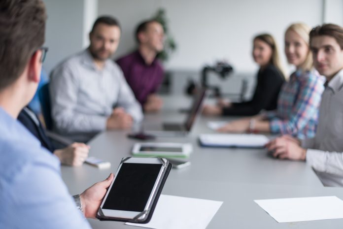 board room meeting with technology