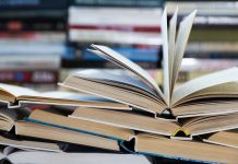 science education reform, A stack of books with colorful covers