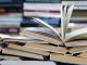 science education reform, A stack of books with colorful covers