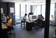 creative team working together at computers in a casual office