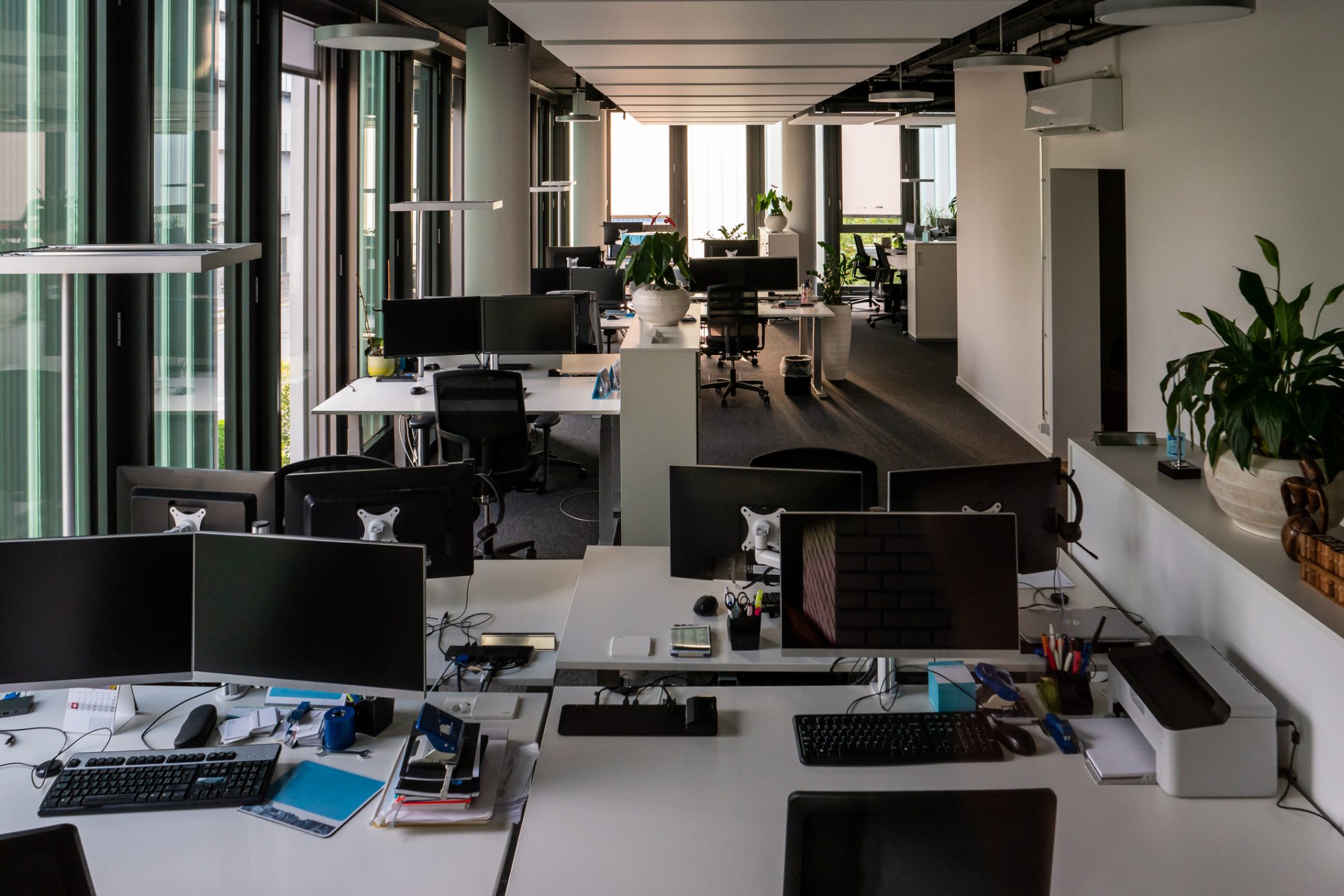 Empty offices with desk computers and no employees