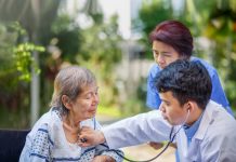 Helping an elderly patient in Japan