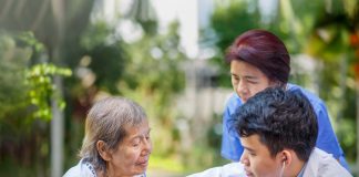 Helping an elderly patient in Japan