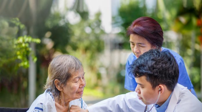 Helping an elderly patient in Japan