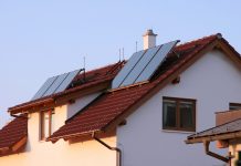 Family house with solar panels on the roof for water heating