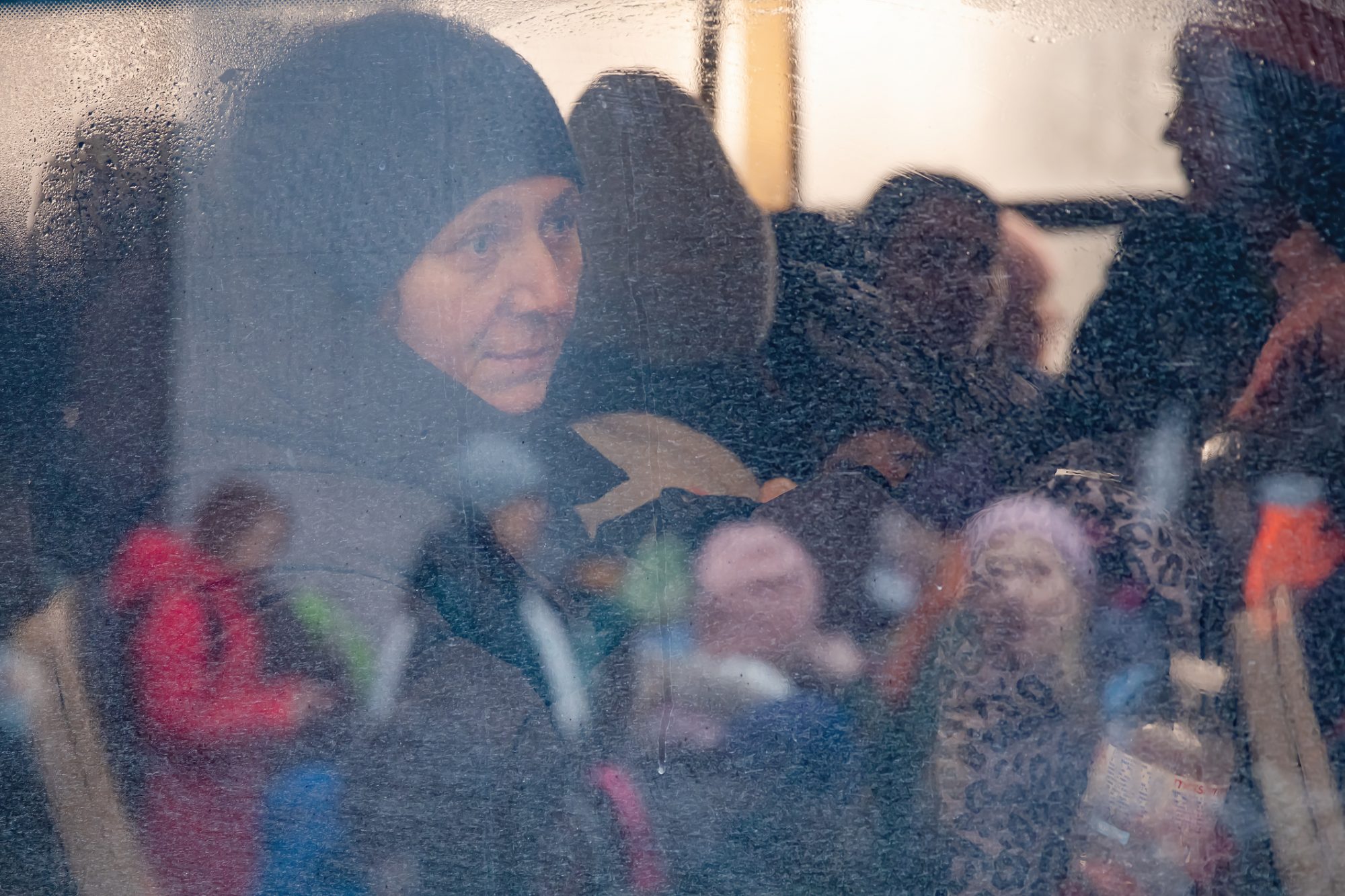 Ukrainian woman on a bus fleeing war as a refugee