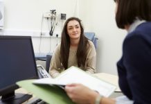 female patient listening to her medical record