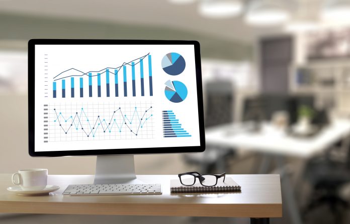 data analytics on a screen with glasses next to it