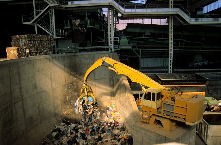 Waste disposal digger separating recycling