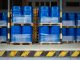 Toxic waste/chemicals stored in barrels at a plant - blue cans with chemicals, industry oil barrels