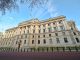 HM Treasury building in London looms against a blue sky