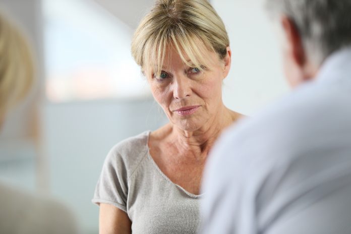 Senior white woman suffering with dementia and depression/anxiety receiving talk therapy