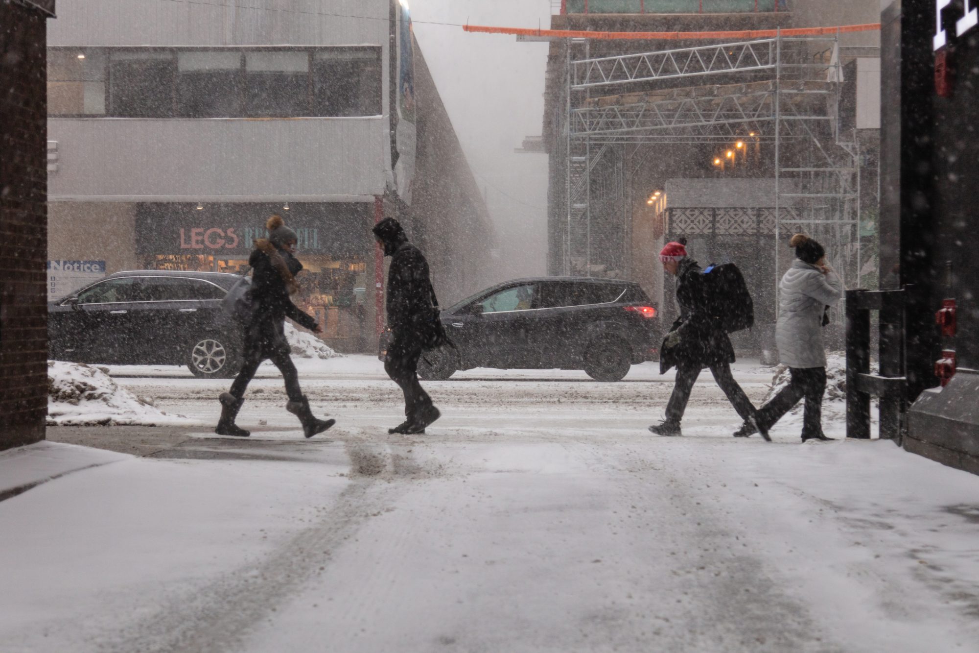 People walking down a busy Canadian street