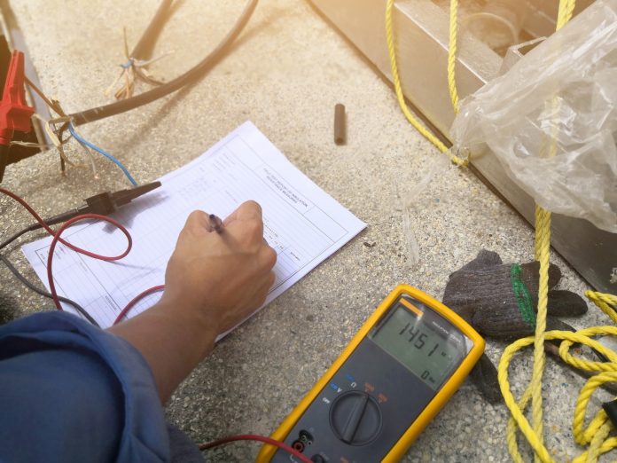 Engineer checking or inspection insulation resistance measuring for electric wire energy