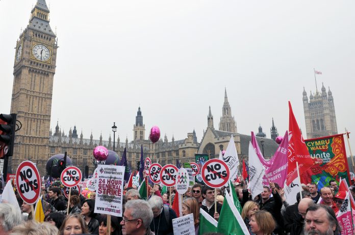 Austerity protesters march on Parliament in opposition to government spending cuts on March 26, 2011 in London, UK. An estimated 250,000 people took part in the TUC organised rally.