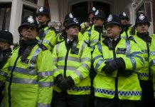 LONDON, UK - MARCH 1TH 2014. London protesters march against worldwide government corruption. In London on 1th March 2014.