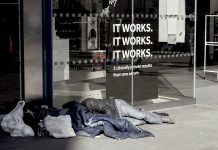 Homeless man begging on Oxford street, London