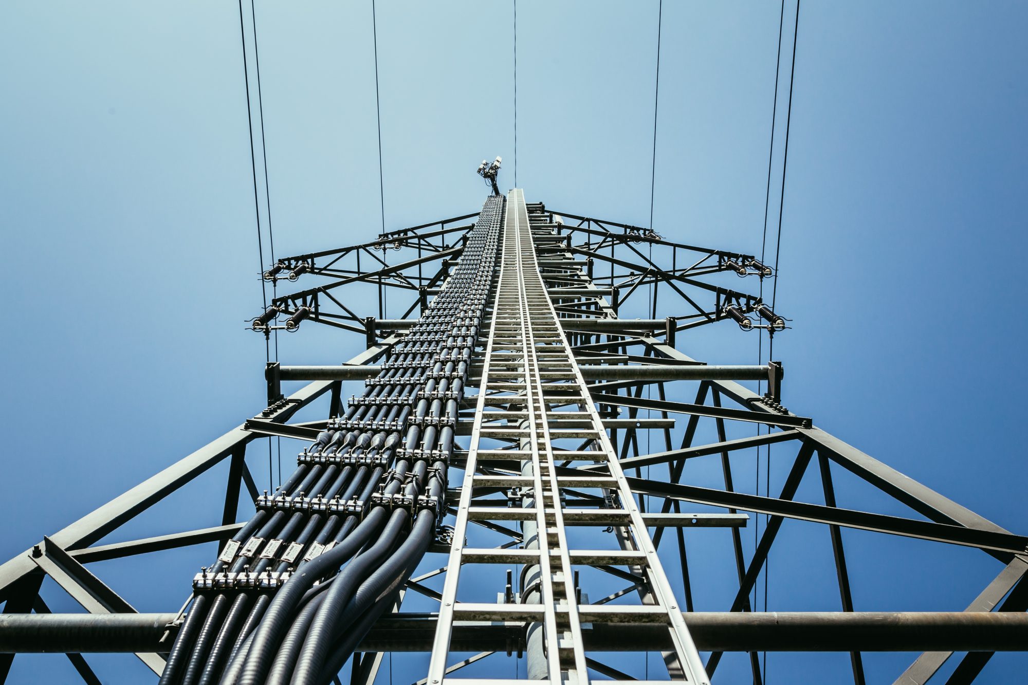 Picture of an electrical tower or pylon, blue sky in the background