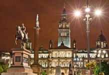 George Square in Glasgow at night, bright lights, buildings