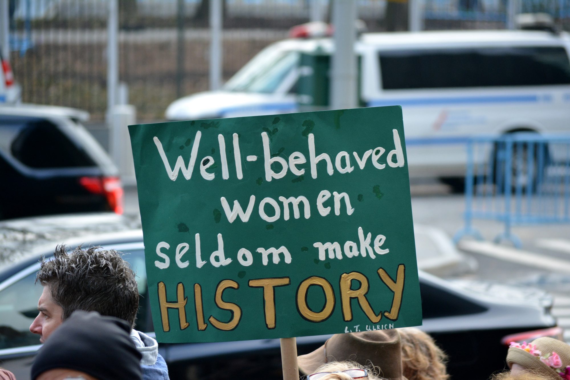 Green sign reading 'Well-behaved women seldom make HISTORY'