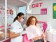 dentist and patient sat in chair looking in mirror