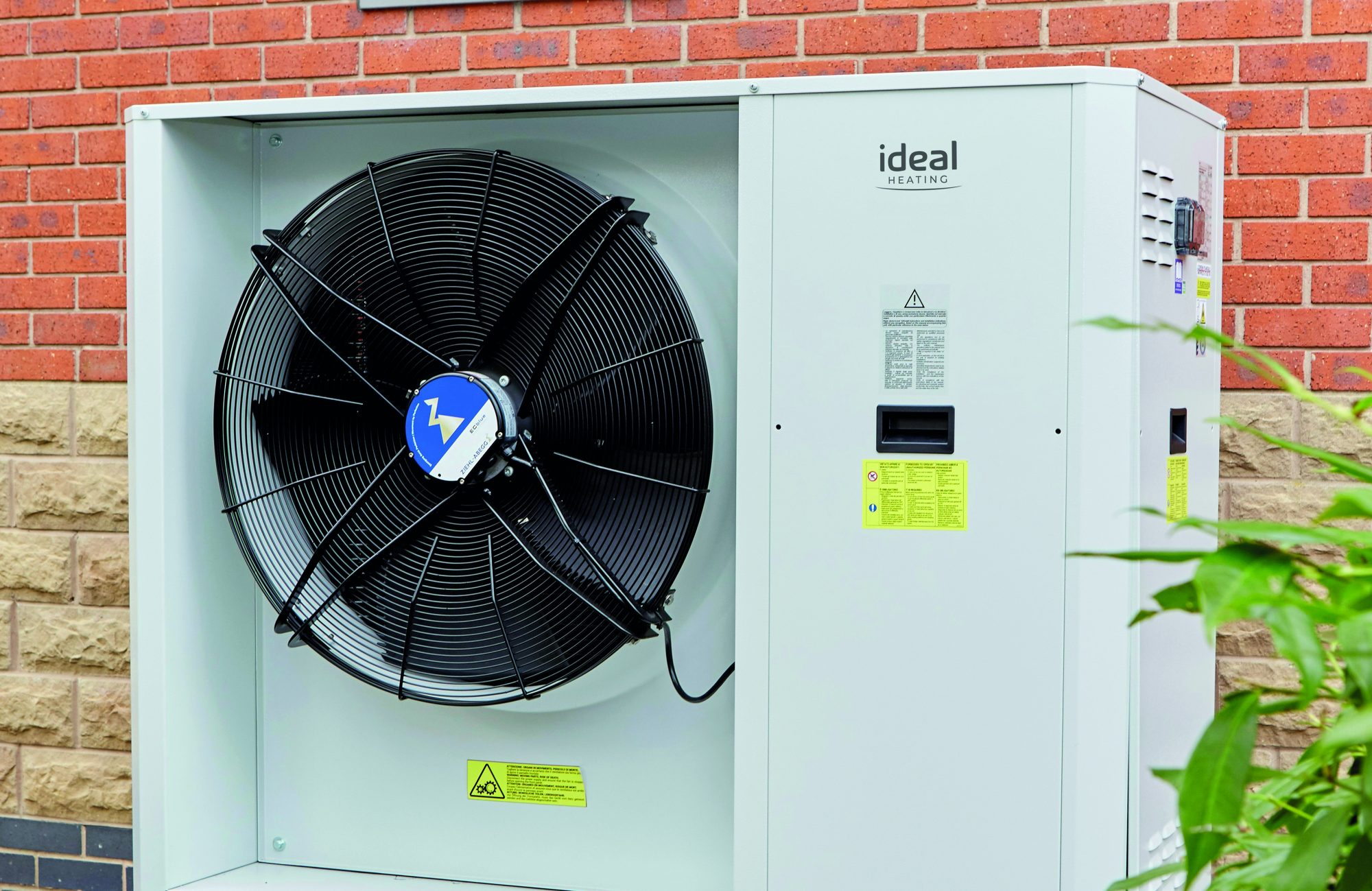 Ideal Heating Ecomod Commercial heat pump 32kW positioned outside a building[87]