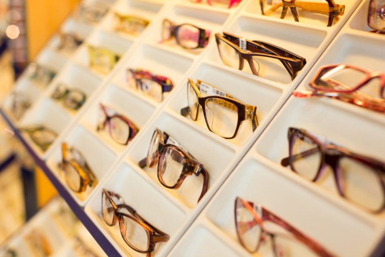 Eyeglasses, shades and sunglasses in optometrist shop