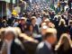 Crowd of people walking on city street to work