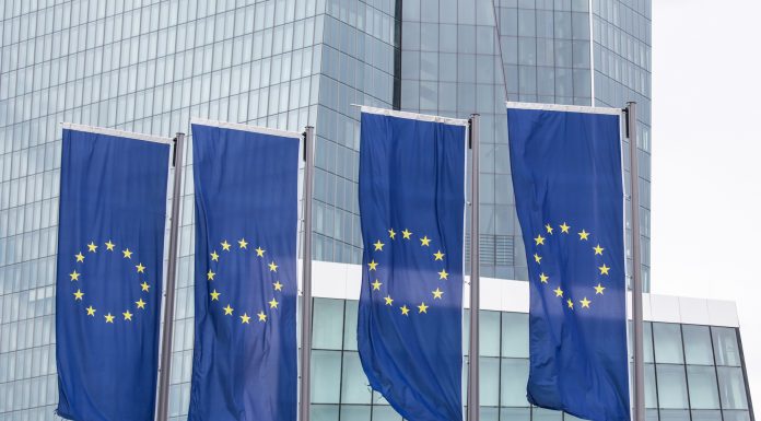 New european central bank in frankfurt germany with europe flags