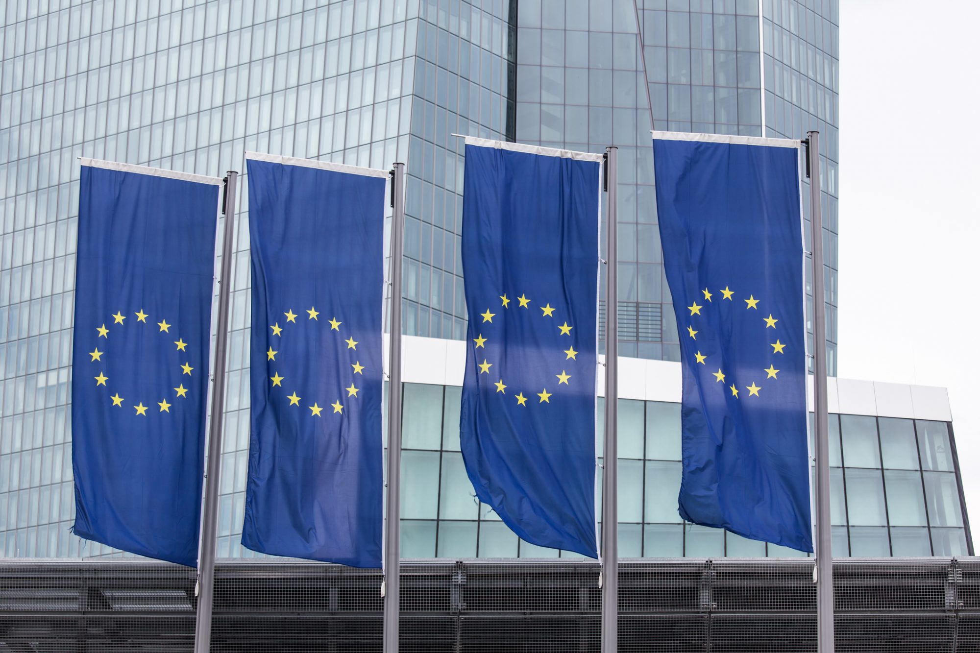 New european central bank in frankfurt germany with europe flags