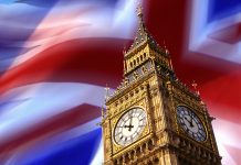 The Clock Tower of Big Ben in London in Great Britain pictured in front of the Union Jack flag