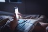 person online in bed, online safety bill