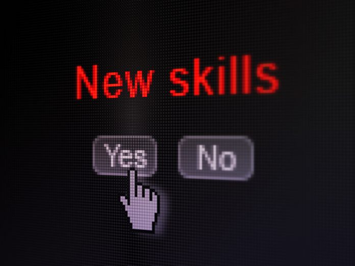 Black computer screen showing YES and NO options to New Skills; cursor pointing to YES