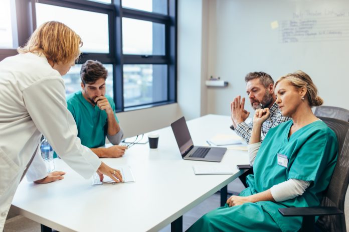 Group of medical professionals brainstorming in meeting