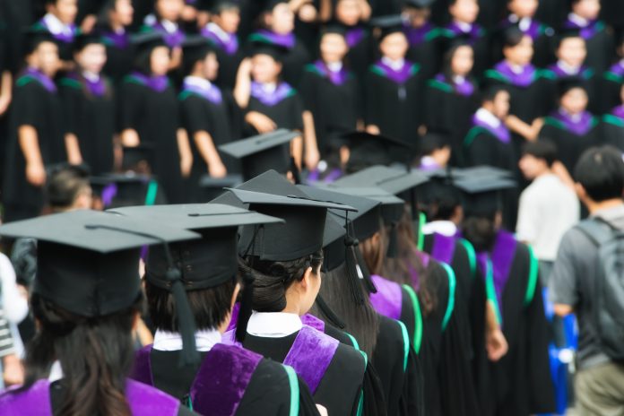 Back of graduates during commencement at university