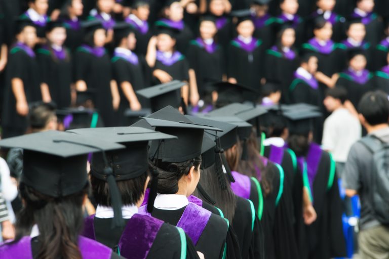 Back of graduates during commencement at university