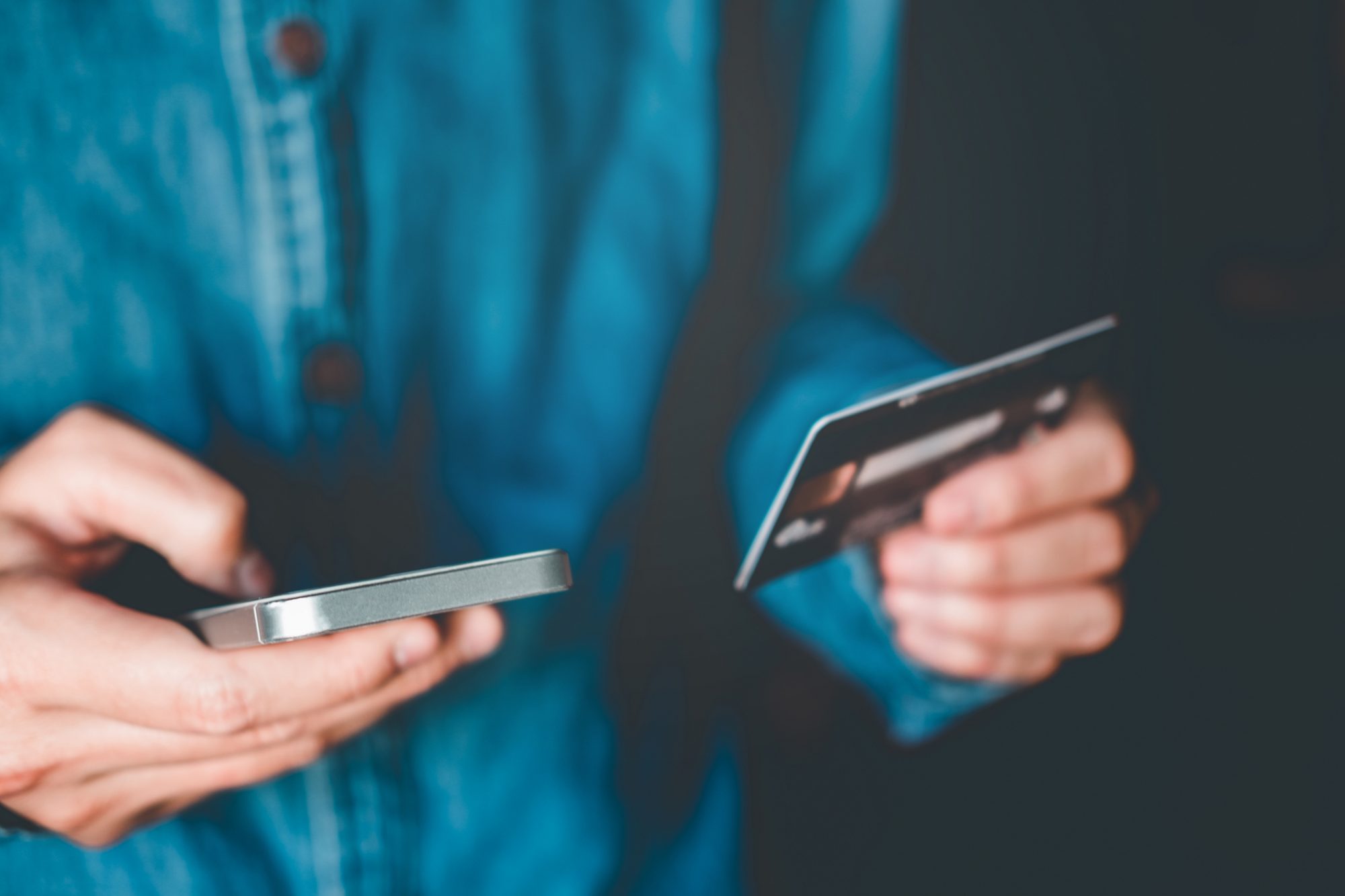 Online banking businessman using smartphone with credit card