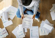 Woman looking at the house bills