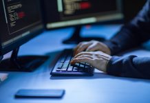 Hacker using computer virus for cyber attack