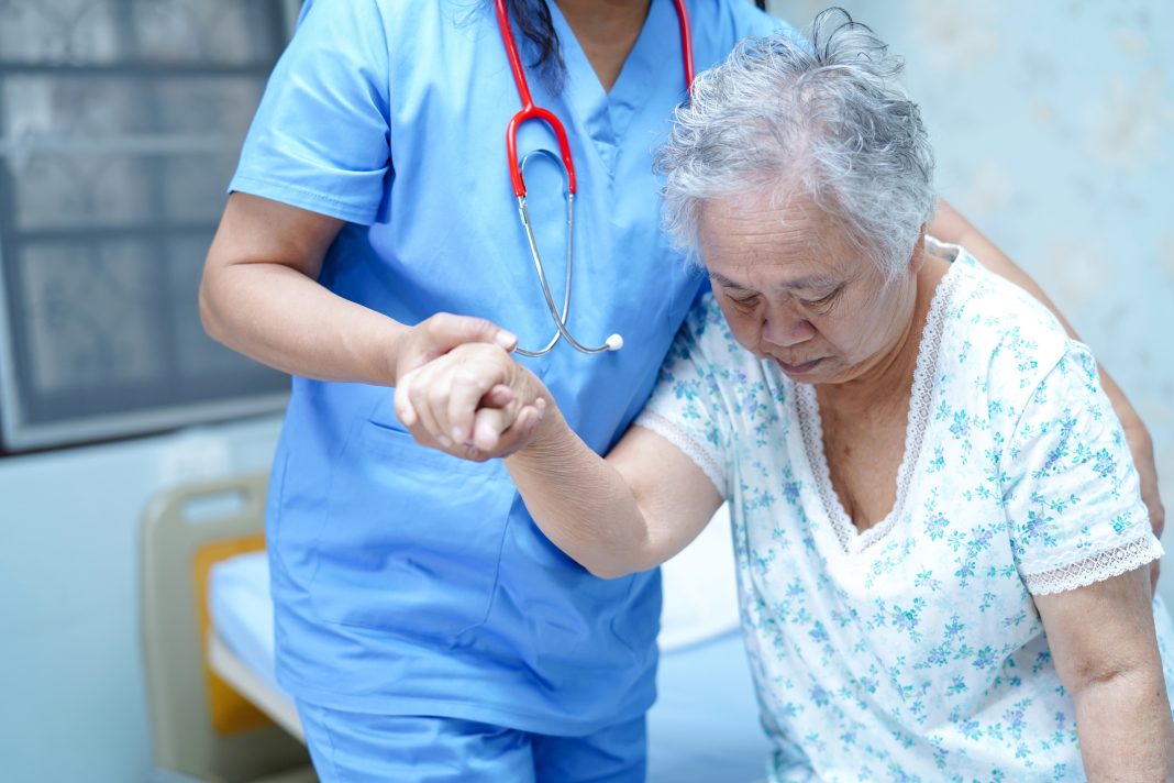 woman caring for an elderly woman