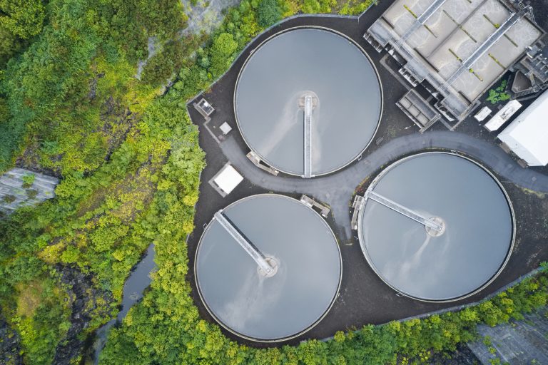 Sewage water works treatment plant aerial view from above showing waste quality control tanks