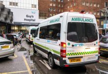 Ambulance vans front of Guy`s Hospital - one of largest medical / teaching facility