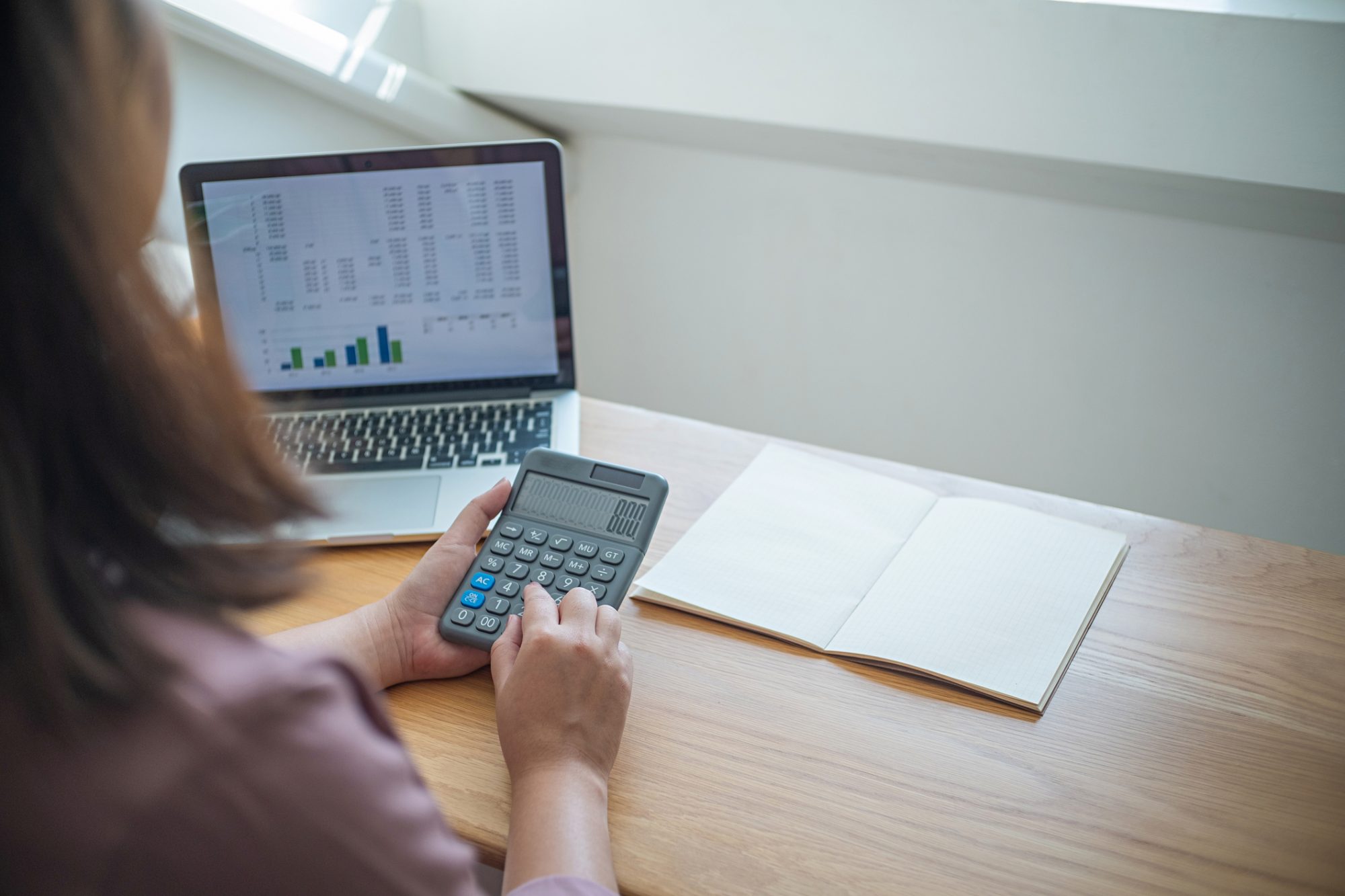 women checking bills. taxes bank account balance and calculating annual financial statements